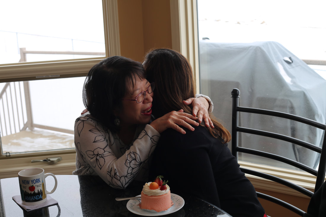 image of two senior women hugging